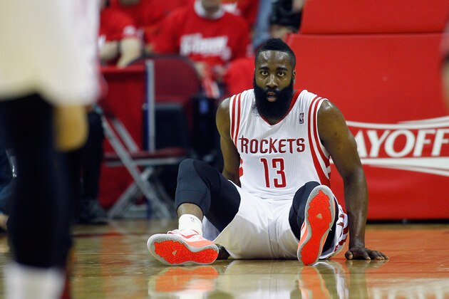 HOUSTON, TX - APRIL 20:  James Harden #13 of the Houston Rockets falls to the floor during game action in Game One of the Western Conference Quarterfinals during the 2014 NBA Playoffs at the Toyota Center on April 20, 2014 in Houston, Texas. NOTE TO USER: User expressly acknowledges and agrees that, by downloading and or using this photograph, User is consenting to the terms and conditions of the Getty Images License Agreement.  (Photo by Bob Levey/Getty Images)