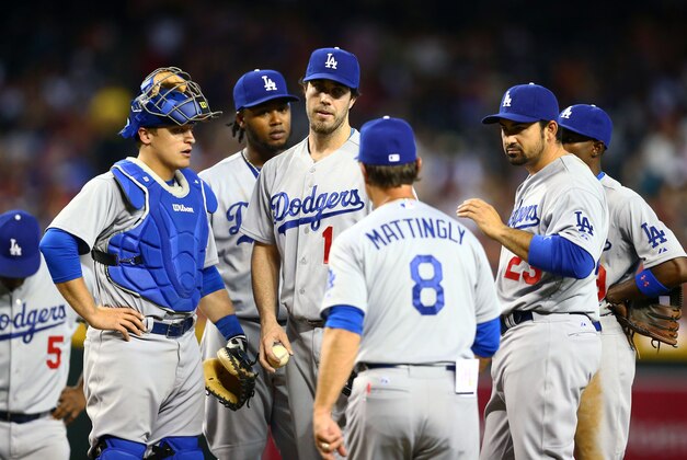 Apr 13, 2014; Phoenix, AZ, USA; Los Angeles Dodgers catcher Tim Federowicz (left) looks on as pitcher Dan Haren (center) is pulled from the game by manager Don Mattingly against the Arizona Diamondbacks at Chase Field. Mandatory Credit: Mark J. Rebilas-USA TODAY Sports