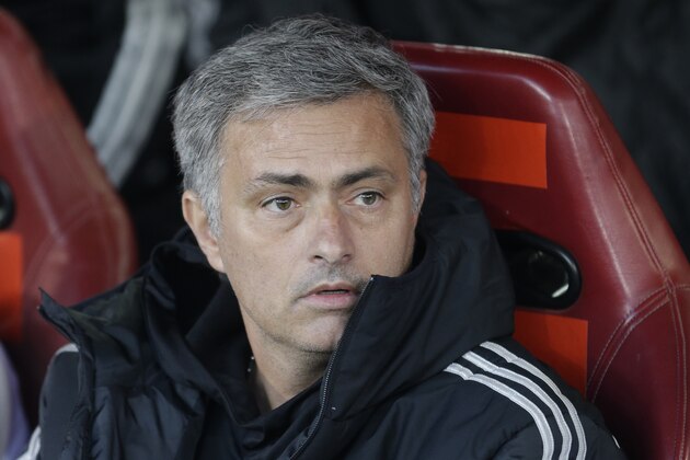 Chelsea's manager Jose Mourinho waits for the start of Champions League semifinal first leg, soccer match between Atletico Madrid and Chelsea at the Vicente Calderon stadium in Madrid, Spain, Tuesday, April 22, 2014 .(AP Photo/Paul White)