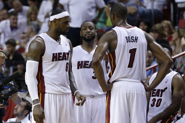 Miami Heat's LeBron James (6), Dwyane Wade (3) and Chris Bosh (1) talk during a timeout in the second half in Game 1 of an opening-round NBA basketball playoff series against the Charlotte Bobcats, Sunday, April 20, 2014, in Miami. The Heat defeated the Bobcats 99-88. (AP Photo/Lynne Sladky) Miami Heat's LeBron James (6), Dwyane Wade (3) and Chris Bosh (1) talk during a timeout in the second half in Game 1 of an opening-round NBA basketball playoff series against the Charlotte Bobcats, Sunday, April 20, 2014, in Miami. The Heat defeated the Bobcats 99-88. (AP Photo/Lynne Sladky)