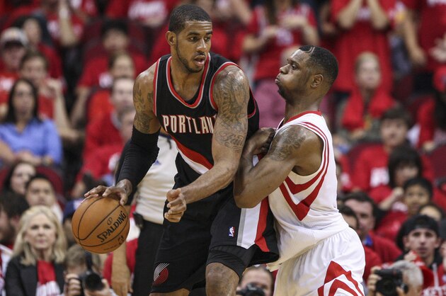 Apr 20, 2014; Houston, TX, USA; Portland Trail Blazers forward LaMarcus Aldridge (12) dribbles the ball during the fourth quarter as Houston Rockets forward Terrence Jones (6) defends in game one during the first round of the 2014 NBA Playoffs at Toyota Center. Mandatory Credit: Troy Taormina-USA TODAY Sports Apr 20, 2014; Houston, TX, USA; Portland Trail Blazers forward LaMarcus Aldridge (12) dribbles the ball during the fourth quarter as Houston Rockets forward Terrence Jones (6) defends in game one during the first round of the 2014 NBA Playoffs at Toyota Center. Mandatory Credit: Troy Taormina-USA TODAY Sports