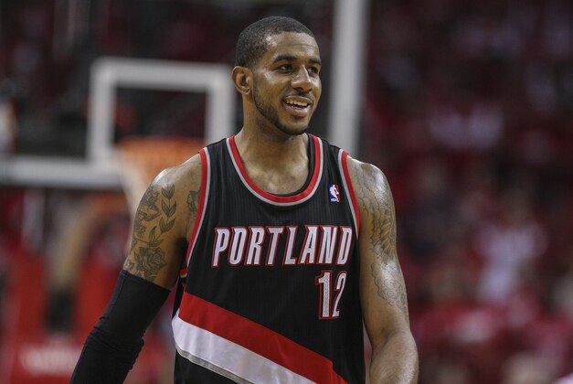 Apr 20, 2014; Houston, TX, USA; Portland Trail Blazers forward LaMarcus Aldridge (12) reacts after a play during the fourth quarter against the Houston Rockets in game one during the first round of the 2014 NBA Playoffs at Toyota Center. Mandatory Credit: Troy Taormina-USA TODAY Sports