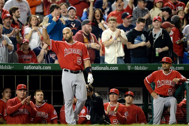 WASHINGTON, DC - APRIL 22: Albert Pujols #5 of the Los Angeles Angels of Anaheim acknowledges the crowd after hitting a two-run home run against the Washington Nationals in the fifth inning at Nationals Park on April 22, 2014 in Washington, DC. The home run home was Albert Pujols' 500th. (Photo by Patrick Smith/Getty Images)