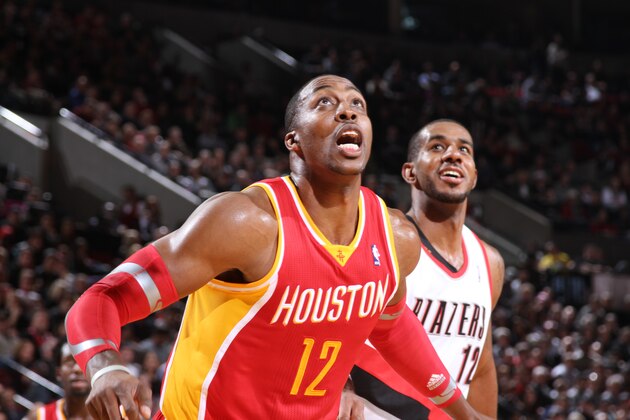 PORTLAND, OR - DECEMBER 12:  Dwight Howard #12 of the Houston Rockets boxes out LaMarcus Aldridge #12 of the Portland Trail Blazers on December 12, 2013 at the Moda Center Arena in Portland, Oregon. NOTE TO USER: User expressly acknowledges and agrees that, by downloading and or using this photograph, user is consenting to the terms and conditions of the Getty Images License Agreement. Mandatory Copyright Notice: Copyright 2013 NBAE (Photo by Sam Forencich/NBAE via Getty Images)