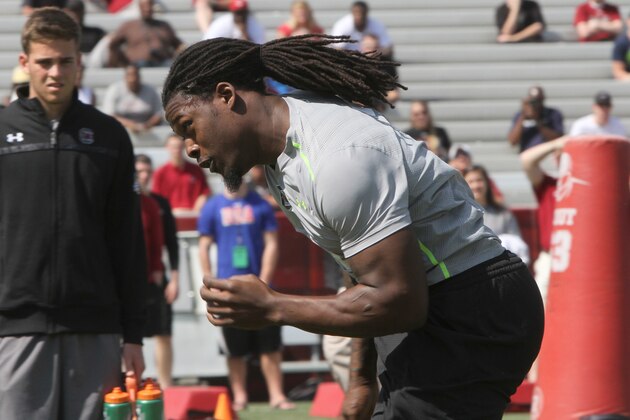 South Carolina defensive end Jadeveon Clowney competes in a drill for NFL representatives at South Carolina football pro day in Columbia, S.C., Wednesday, April 2, 2014. (AP Photo/Mary Ann Chastain)