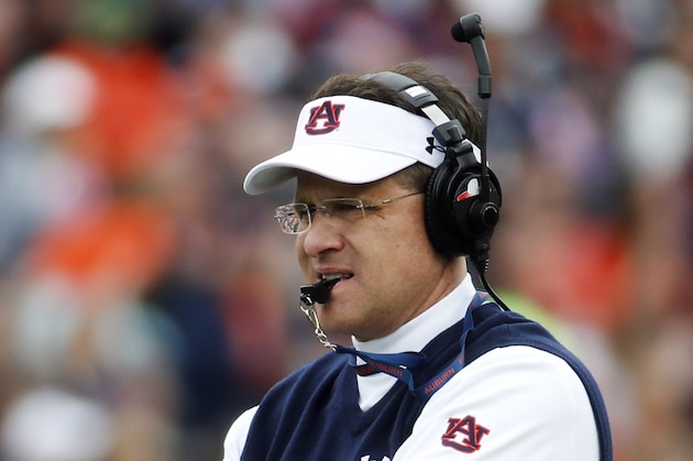 Auburn coach Gus Malzahan watches the first half of the NCAA college football team's annual A Day spring game Saturday, April 19, 2014, in Auburn, Ala.  (AP Photo/John Bazemore)