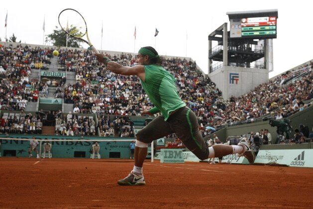 Spain's Rafael Nadal returns the ball to France's Nicolas Devilder during their second round match at the French Open tennis tournament in Paris on Thursday May 29, 2008. (AP Photo/Michel Spingler)