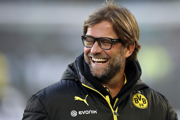 Dortmund head coach Juergen Klopp laughs during the warm up for the German first division Bundesliga soccer match between VfL Wolfsburg and Borussia Dortmund in Wolfsburg, Germany, Saturday, Nov. 9, 2013. Wolfsburg defeated Dortmund by 2-1. (AP Photo/Michael Sohn)