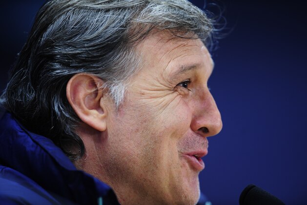 FC Barcelona's coach Gerardo Tata Martino, from Argentina, attends a press conference at the Sports Center FC Barcelona Joan Gamper in San Joan Despi, Spain, Monday, March 31, 2014.FC Barcelona will face Atletico Madrid in a first leg quarter-final Champions League soccer match on Tuesday. (AP Photo/Manu Fernandez)