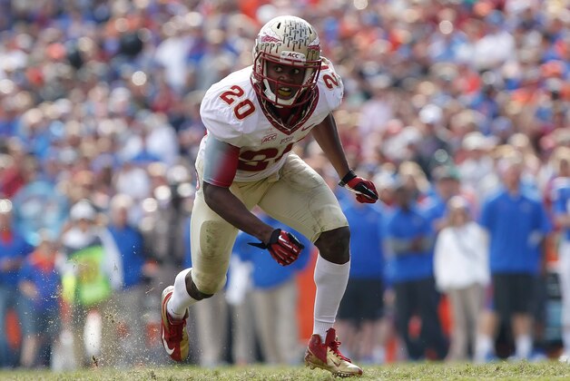 Nov 30, 2013; Gainesville, FL, USA; Florida State Seminoles defensive back Lamarcus Joyner (20) rushes against the Florida Gators during the second half at Ben Hill Griffin Stadium. Florida State Seminoles defeated the Florida Gators 37-7. Mandatory Credit: Kim Klement-USA TODAY Sports