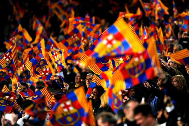 BARCELONA, SPAIN - MARCH 12:  Barcelona fans cheer on their team during the UEFA Champions League Round of 16, second leg match between FC Barcelona and Manchester City  at Camp Nou on March 12, 2014 in Barcelona, Spain.  (Photo by David Ramos/Getty Images)