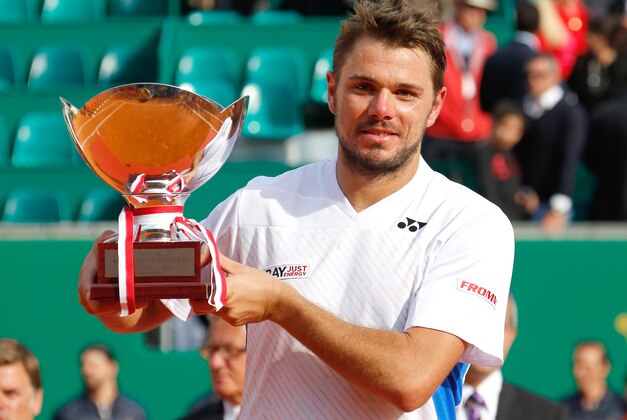Stanislas Wawrinka of Switzerland holds his trophy after defeating Roger Federer of Switzerland in their final match at the Monte Carlo Tennis Masters tournament,  in Monaco, Sunday, April, 20, 2014. Wawrinka won 4-6, 7-6, 6-2. (AP Photo/Claude Paris)