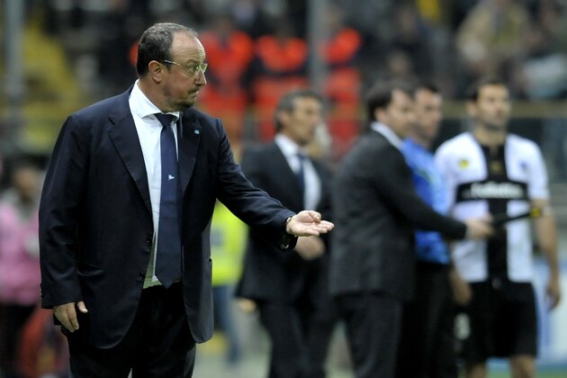 Napoli coach Rafael Benitez of Spain gives indications to his players during a serie A soccer match between Parma and Napoli at Parma's Tardini stadium, Italy, Sunday, April 6, 2014. (AP Photo/Marco Vasini)