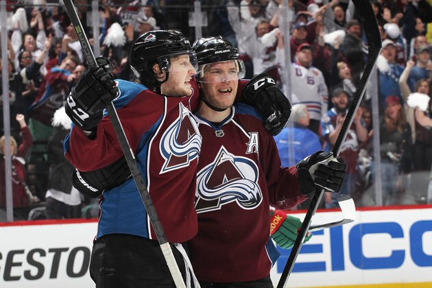 DENVER, CO - APRIL 19: Nathan MacKinnon #29 and Paul Stastny #26 of the Colorado Avalanche celebrate an open net goal late in the third period against the Minnesota Wild in Game Two of the First Round of the 2014 Stanley Cup Playoffs at the Pepsi Center on April 19, 2014 in Denver, Colorado.  The Avalanche defeated the Wild 4-2.  (Photo by Michael Martin/NHLI via Getty Images)