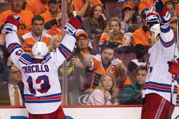 New York Rangers' Daniel Carcillo, left, celebrates his goal as he faces with fans with Brian Boyle, right, coming to him during the third period in Game 3 of an NHL hockey first-round playoff series, Tuesday, April 22, 2014, in Philadelphia. The Rangers won 4-1. (AP Photo/Chris Szagola)