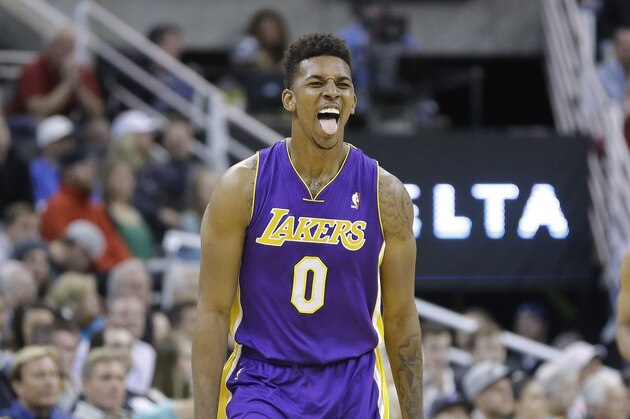 Los Angeles Lakers' Nick Young (0) reacts after hitting a 3-pointer in the second half during an NBA basketball game the Utah Jazz Monday, April 14, 2014, in Salt Lake City, Utah. (AP Photo/Rick Bowmer)
