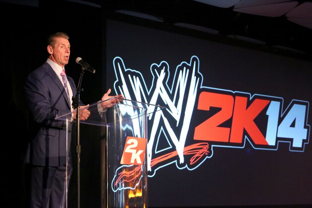IMAGE DISTRIBUTED FOR 2K - WWE Chairman and CEO Mr. McMahon welcomes guests to the WWE 2K14 press event, on Saturday, Aug. 17, 2013 in Los Angeles.  (Photo by Casey Rodgers/Invision for 2K/AP Images)