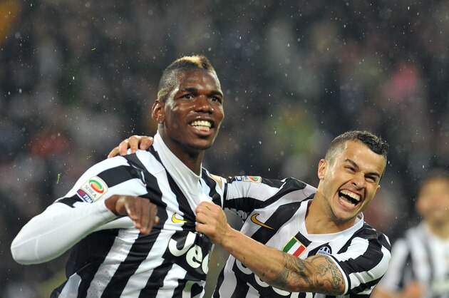 TURIN, ITALY - APRIL 19:  Paul Pogba (L) of Juventus celebrates after scoring the opening goal with team mate Sebastian Giovinco during the Serie A match between Juventus and Bologna FC at Juventus Arena on April 19, 2014 in Turin, Italy.  (Photo by Valerio Pennicino/Getty Images)
