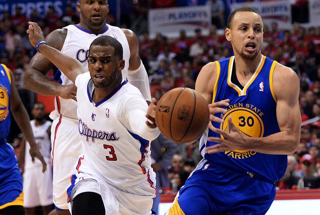 Apr 19, 2014; Los Angeles, CA, USA;  Golden State Warriors guard Stephen Curry (30) drives the lane past Los Angeles Clippers guard Chris Paul (3) and center Ryan Hollins (15) in the first half  in game one during the first round of the 2014 NBA Playoffs at Staples Center. Mandatory Credit: Jayne Kamin-Oncea-USA TODAY Sports
