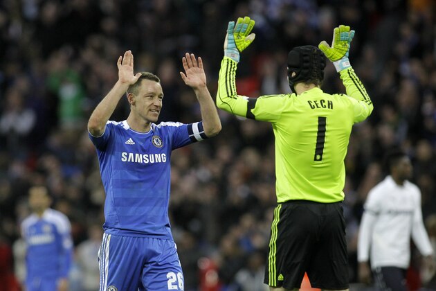 Chelsea's John Terry, left, celebrates with team mate goalkeeper Petr Cech after beating Tottenham Hotspur in their English FA Cup semifinal soccer match at Wembley Stadium in London, Sunday, April 15, 2012. (AP Photo/Sang Tan)