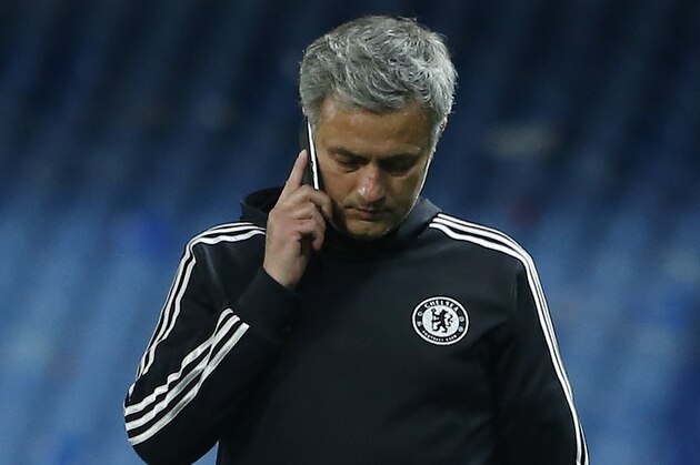 Chelsea's manager Jose Mourinho leaves after the Champions League semifinal first leg soccer match between Atletico Madrid and Chelsea at the Vicente Calderon stadium in Madrid, Spain, Tuesday, April 22, 2014. (AP Photo/Andres Kudacki)
