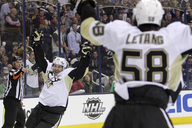 Pittsburgh Penguins' Lee Stempniak, left, celebrates his goal against the Columbus Blue Jackets' during the third period of a first-round NHL playoff hockey game Monday, April 21, 2014, in Columbus, Ohio. The Penguins defeated the Blue Jackets 4-3. (AP Photo/Jay LaPrete)