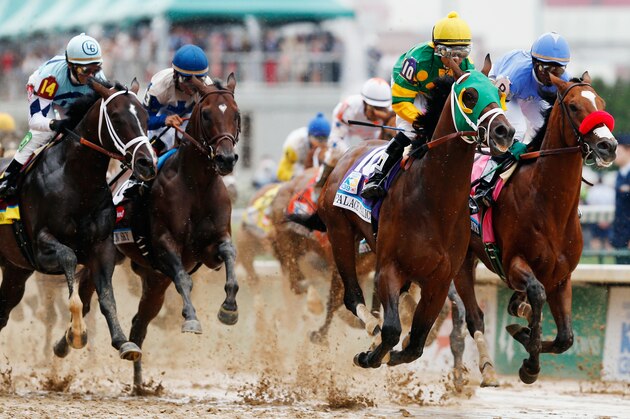 LOUISVILLE, KY - MAY 04: Palace Malice ridden by Mike Smith leads the field into the first turn during the 139th running of the Kentucky Derby at Churchill Downs on May 4, 2013 in Louisville, Kentucky.  (Photo by Rob Carr/Getty Images)
