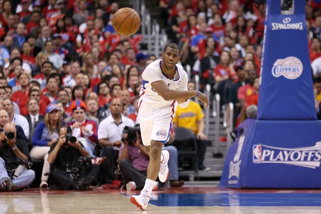 LOS ANGELES, CA - APRIL 21: Chris Paul #3 of the Los Angeles Clippers throws an outlet pass against the Golden State Warriors in Game Two of the Western Conference Quarterfinals during the 2014 NBA Playoffs at Staples Center on April 21, 2014 in Los Angeles, California.  The Clippers won 138-98. NOTE TO USER: User expressly acknowledges and agrees that, by downloading and or using this photograph, User is consenting to the terms and conditions of the Getty Images License Agreement.  (Photo by Stephen Dunn/Getty Images)