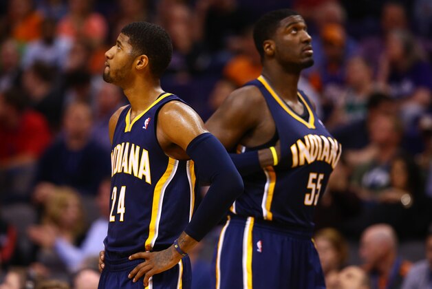 Jan 22, 2014; Phoenix, AZ, USA; Indiana Pacers forward Paul George (left) and center Roy Hibbert react in the second half against the Phoenix Suns at US Airways Center. The Suns defeated the Pacers 124-100. Mandatory Credit: Mark J. Rebilas-USA TODAY Sports Jan 22, 2014; Phoenix, AZ, USA; Indiana Pacers forward Paul George (left) and center Roy Hibbert react in the second half against the Phoenix Suns at US Airways Center. The Suns defeated the Pacers 124-100. Mandatory Credit: Mark J. Rebilas-USA TODAY Sports
