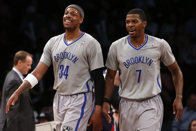 Brooklyn Nets' Paul Pierce (34) and Joe Johnson (7) react during the second half of an NBA basketball game against the Atlanta Hawks Friday, April 11, 2014, in New York.  Atlanta won 93-88. (AP Photo/Jason DeCrow)