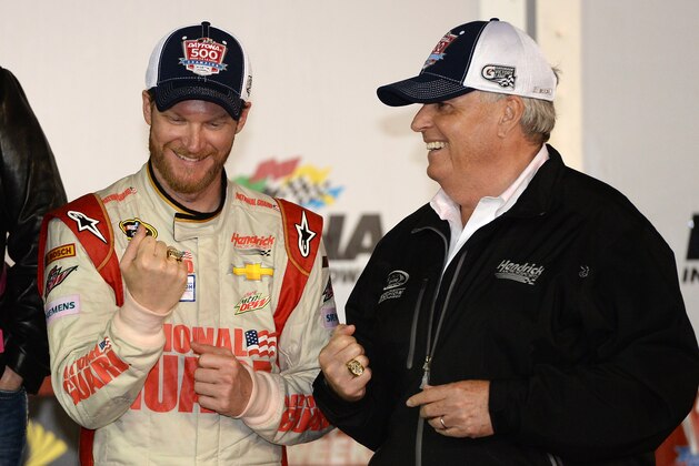 DAYTONA BEACH, FL - FEBRUARY 23:  (L-R) Dale Earnhardt Jr., driver of the #88 National Guard Chevrolet, and team owner Rick Hendrick celebrate in victory lane after winning the NASCAR Sprint Cup Series Daytona 500 at Daytona International Speedway on February 23, 2014 in Daytona Beach, Florida.  (Photo by Patrick Smith/Getty Images)