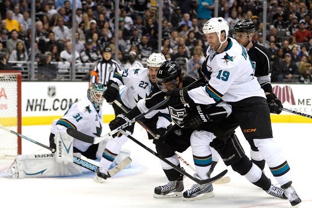 LOS ANGELES, CA - APRIL 22: Joe Thornton #19 of the San Jose Sharks ties up Anze Kopitar #11 of the Los Angeles Kings as he goes for the puck in front of Antti Niemi #31 during the second period in Game Three of the First Round of the 2014 NHL Stanley Cup Playoffs at Staples Center on April 22, 2014 in Los Angeles, California.  (Photo by Harry How/Getty Images)