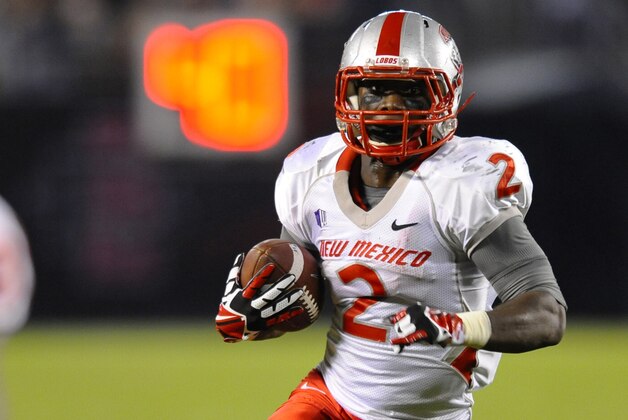 Nov 2, 2013; San Diego, CA, USA; New Mexico Lobos running back Crusoe Gongbay (2) runs for a touchdown during the third quarter against the San Diego State Aztecs at Qualcomm Stadium.The Aztecs won 35-30. Mandatory Credit: Christopher Hanewinckel-USA TODAY Sports
