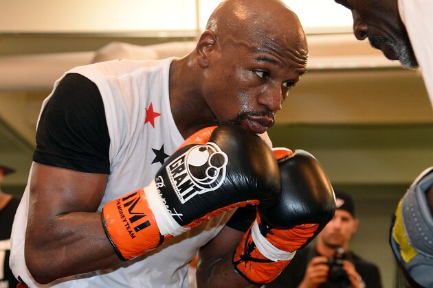 LAS VEGAS, NV - APRIL 22:  Boxer Floyd Mayweather Jr. works out with his trainer and uncle Roger Mayweather at the Mayweather Boxing Club on April 22, 2014 in Las Vegas, Nevada. Mayweather will face Marcos Maidana in a 12-round world championship unification bout in Las Vegas on May 3.  (Photo by Ethan Miller/Getty Images)