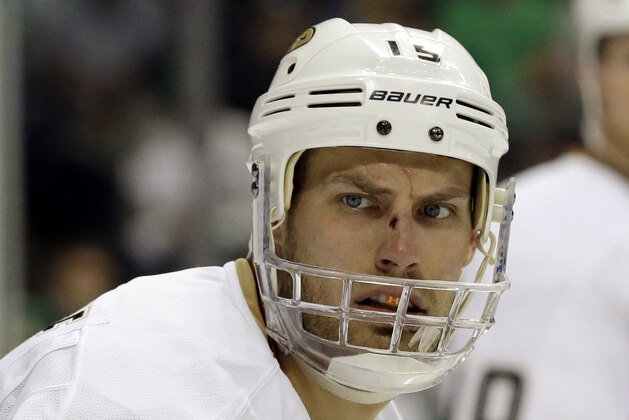 Anaheim Ducks' Ryan Getzlaf (15) in a face off against the Dallas Stars in the third period of Game 3 of a first-round NHL hockey Stanley Cup playoff series game, Monday, April 21, 2014, in Dallas. The Stars won 3-0.  (AP Photo/Tony Gutierrez)