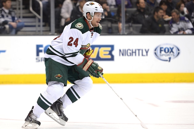 LOS ANGELES, CA - MARCH 31:  Matt Cooke #24 of the Minnesota Wild forechecks against the Los Angeles Kings at Staples Center on March 31, 2014 in Los Angeles, California.  (Photo by Harry How/Getty Images)