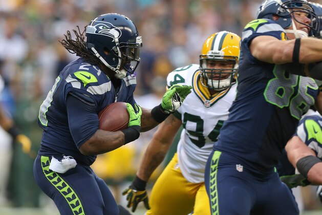 SEATTLE, WA - SEPTEMBER 24:  Running back Marshawn Lynch #24 of the Seattle Seahawks rushes against the Green Bay Packers at CenturyLink Field on September 24, 2012 in Seattle, Washington.  (Photo by Otto Greule Jr/Getty Images)