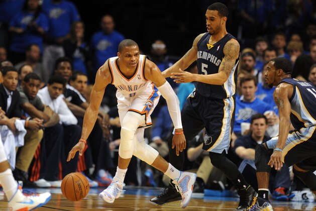 Apr 19, 2014; Oklahoma City, OK, USA; Oklahoma City Thunder guard Russell Westbrook (0) handles the ball against Memphis Grizzlies guard Courtney Lee (5) during the second quarter in game one during the first round of the 2014 NBA Playoffs at Chesapeake Energy Arena. Mandatory Credit: Mark D. Smith-USA TODAY Sports