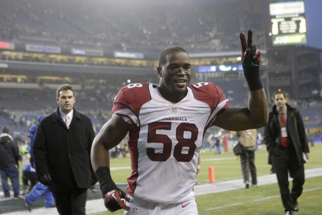 Arizona Cardinals inside linebacker Daryl Washington jogs off the field after the Cardinals beat the Seahawks 17-10 in an NFL football game, Sunday, Dec. 22, 2013, in Seattle. The Cardinals 17-10. (AP Photo/Stephen Brashear)