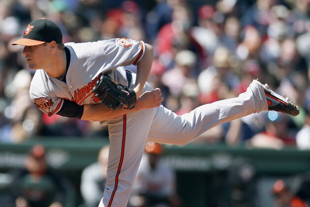 Baltimore Orioles' Bud Norris follows through on a pitch in the first inning of a baseball game against the Boston Red Sox in Boston, Saturday, April 19, 2014. (AP Photo/Michael Dwyer)