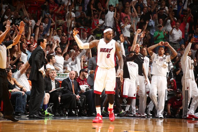 MIAMI, FL - APRIL 11:  LeBron James #6 of the Miami Heat reacts to a made three point basket during a game on April 11, 2014 at American Airlines Arena in Miami, Florida.  NOTE TO USER: User expressly acknowledges and agrees that, by downloading and or using this photograph, User is consenting to the terms and conditions of the Getty Images License Agreement. Mandatory Copyright Notice: Copyright 2014 NBAE  (Photo by Nathaniel S. Butler/NBAE via Getty Images)