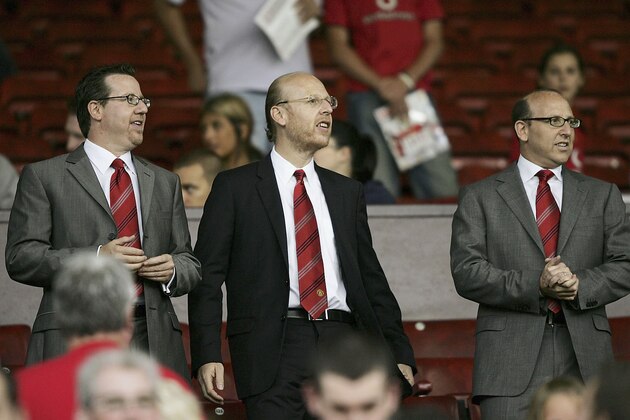 MANCHESTER, ENGLAND-AUGUST 9 : (L to R) Joel Glazer, Avram Glazer and Bryan Glazer, sons of owner Malcolm Glazer, are seen before the Champions League third qualifying round, first leg match between Manchester United and Debreceni VSC at Old Trafford on August 9, 2005 in Manchester, England.  (Photo by Clive Brunskill/Getty Images)