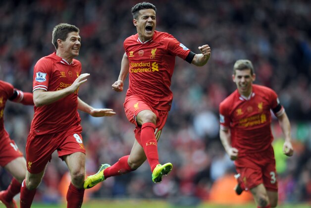 Liverpool's Philippe Coutinho, centre, celebrates with teammate Steven Gerrard, left, after he scored the third goal of the game for his side during their English Premier League soccer match against Manchester City at Anfield in Liverpool, England, Sunday April. 13, 2014. (AP Photo/Clint Hughes) Liverpool's Philippe Coutinho, centre, celebrates with teammate Steven Gerrard, left, after he scored the third goal of the game for his side during their English Premier League soccer match against Manchester City at Anfield in Liverpool, England, Sunday April. 13, 2014. (AP Photo/Clint Hughes)