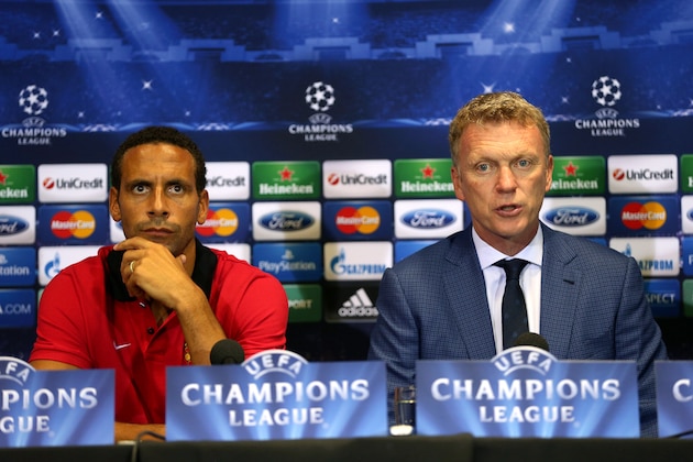 MANCHESTER, ENGLAND - SEPTEMBER 16:  Manchester United manager David Moyes and player Rio Ferdinand answer questions from the media during a press conference ahead of their UEFA Champions League match against Bayer Leverkusen at Old Trafford on September 16, 2013 in Manchester, England.  (Photo by Clive Brunskill/Getty Images)