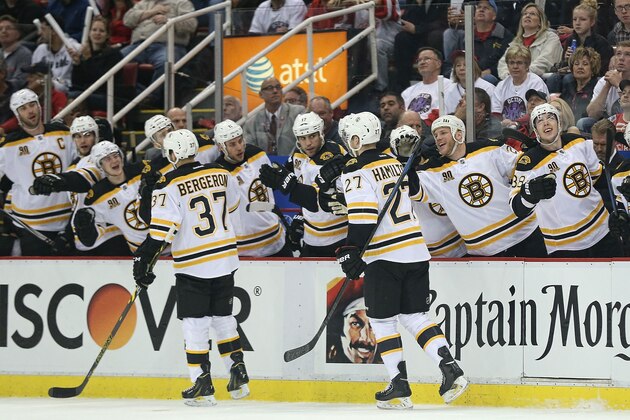 DETROIT, MI - APRIL 22: Dougie Hamilton #27 of the Boston Bruins celebrates with the bench after scoring a first-period goal against the Detroit Red Wings in Game Three of the First Round of the 2014 NHL Stanley Cup Playoffs at Joe Louis Arena on April 22, 2014 in Detroit, Michigan. (Photo by Leon Halip/Getty Images) DETROIT, MI - APRIL 22: Dougie Hamilton #27 of the Boston Bruins celebrates with the bench after scoring a first-period goal against the Detroit Red Wings in Game Three of the First Round of the 2014 NHL Stanley Cup Playoffs at Joe Louis Arena on April 22, 2014 in Detroit, Michigan. (Photo by Leon Halip/Getty Images)
