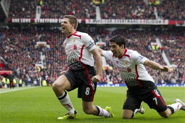 Liverpool's Steven Gerrard celebrates with teammate Luis Suarez, right, after scoring against Manchester United during their English Premier League soccer match at Old Trafford Stadium, Manchester, England, Sunday March 16, 2014. (AP Photo/Jon Super) Liverpool's Steven Gerrard celebrates with teammate Luis Suarez, right, after scoring against Manchester United during their English Premier League soccer match at Old Trafford Stadium, Manchester, England, Sunday March 16, 2014. (AP Photo/Jon Super)