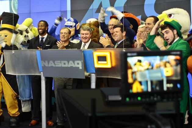 Atlantic Coast Conference mascots join ACC and NASDAQ officials for the ringing of the closing bell on Monday, July 1, 2013 in New York.  The Atlantic Coast Conference officials and coaches visited the NASDAQ Market Site in Times Square to officially announce the addition of its three new members in Notre Dame, Pitt and Syracuse. (AP Photo/Bethan McKernan)