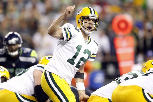 Sept 24, 2012; Seattle, WA, USA; Green Bay Packers quarterback Aaron Rodgers (12) gives an instruction to a teammate to go in motion against the Seattle Seahawks during the fourth quarter warmups at CenturyLink Field. Mandatory Credit: Joe Nicholson-USA TODAY Sports Sept 24, 2012; Seattle, WA, USA; Green Bay Packers quarterback Aaron Rodgers (12) gives an instruction to a teammate to go in motion against the Seattle Seahawks during the fourth quarter warmups at CenturyLink Field. Mandatory Credit: Joe Nicholson-USA TODAY Sports