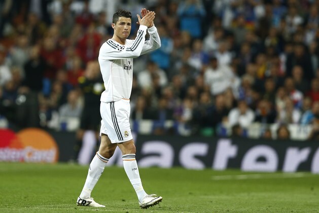 Real's Cristiano Ronaldo claps to his supporters as he leaves the pitch during a first leg semifinal Champions League soccer match between Real Madrid and Bayern Munich at the Santiago Bernabeu stadium in Madrid, Spain, Wednesday, April 23, 2014. (AP Photo/Andres Kudacki)