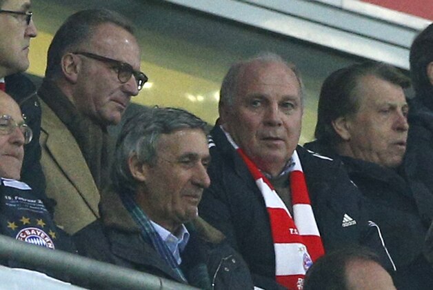 Bayern CEO Karlheinz Rummenigge, left, and president Uli Hoeness watch the Champions League round of 16 second leg soccer match between FC Bayern Munich and FC Arsenal in Munich, Germany, Tuesday, March 11, 2014. (AP Photo/Matthias Schrader)